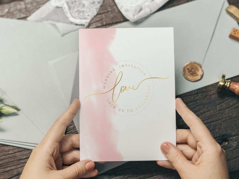 Woman with a wedding invitation card mockup